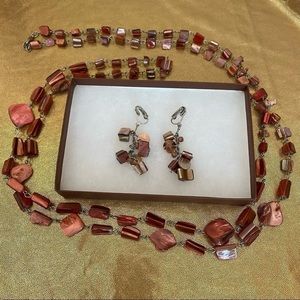 Orange shell pieces w/silver tone metal rope necklace and earrings.